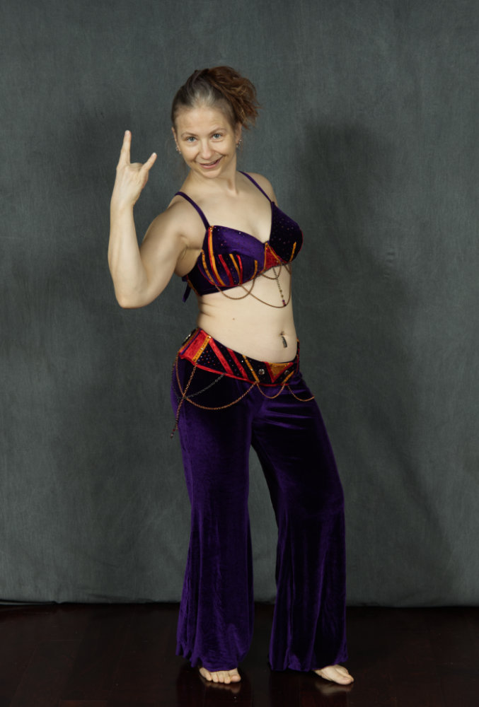 Image of Author Neta wearing a custom bellydancer costume